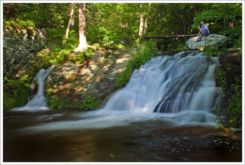 Big Rock Falls is located along the trail right before you cross the river.